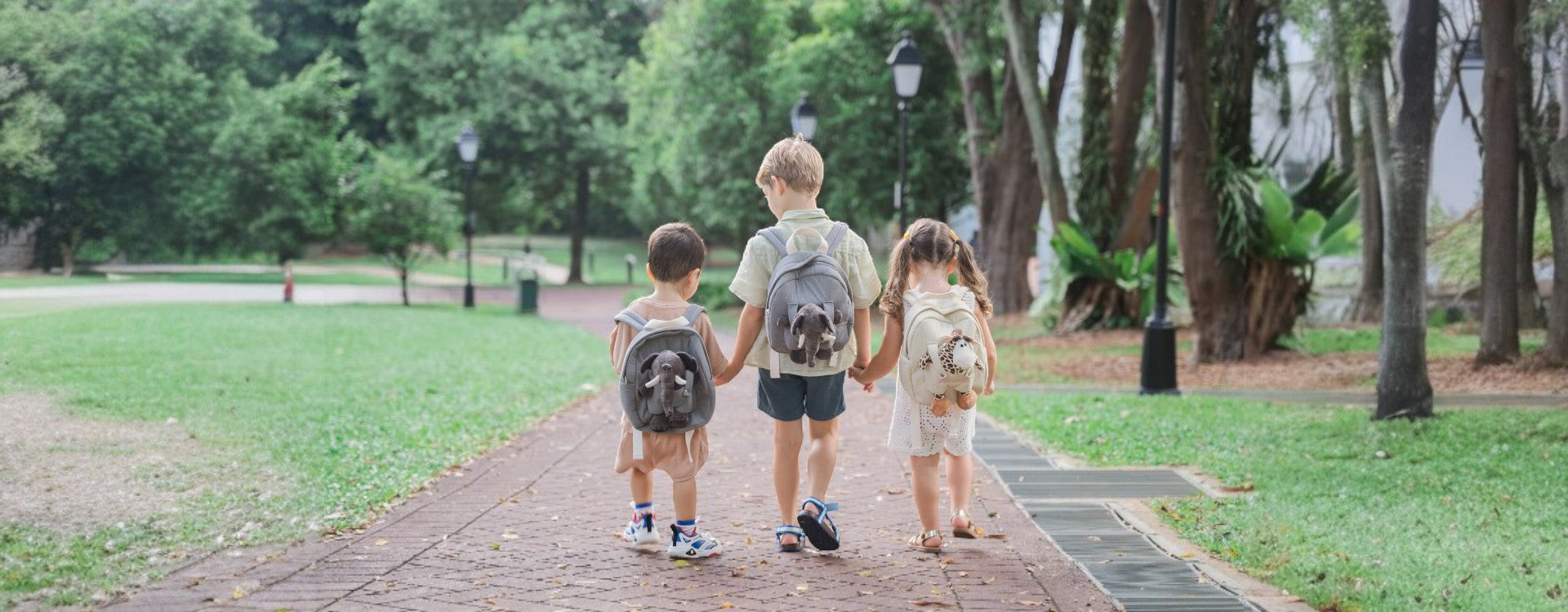 Toddles and Children carrying personalised animal backpacks