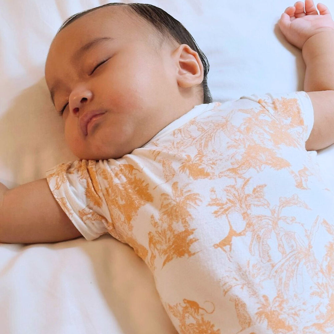 Baby wearing Little Noah Premium Bamboo Safari Classic Romper in Orange\
