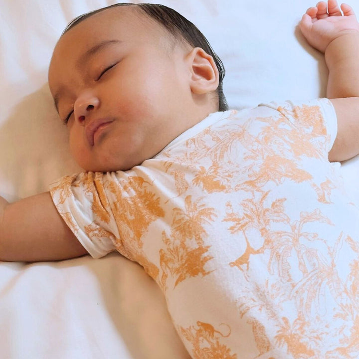 Baby wearing Little Noah Premium Bamboo Safari Classic Romper in Orange\