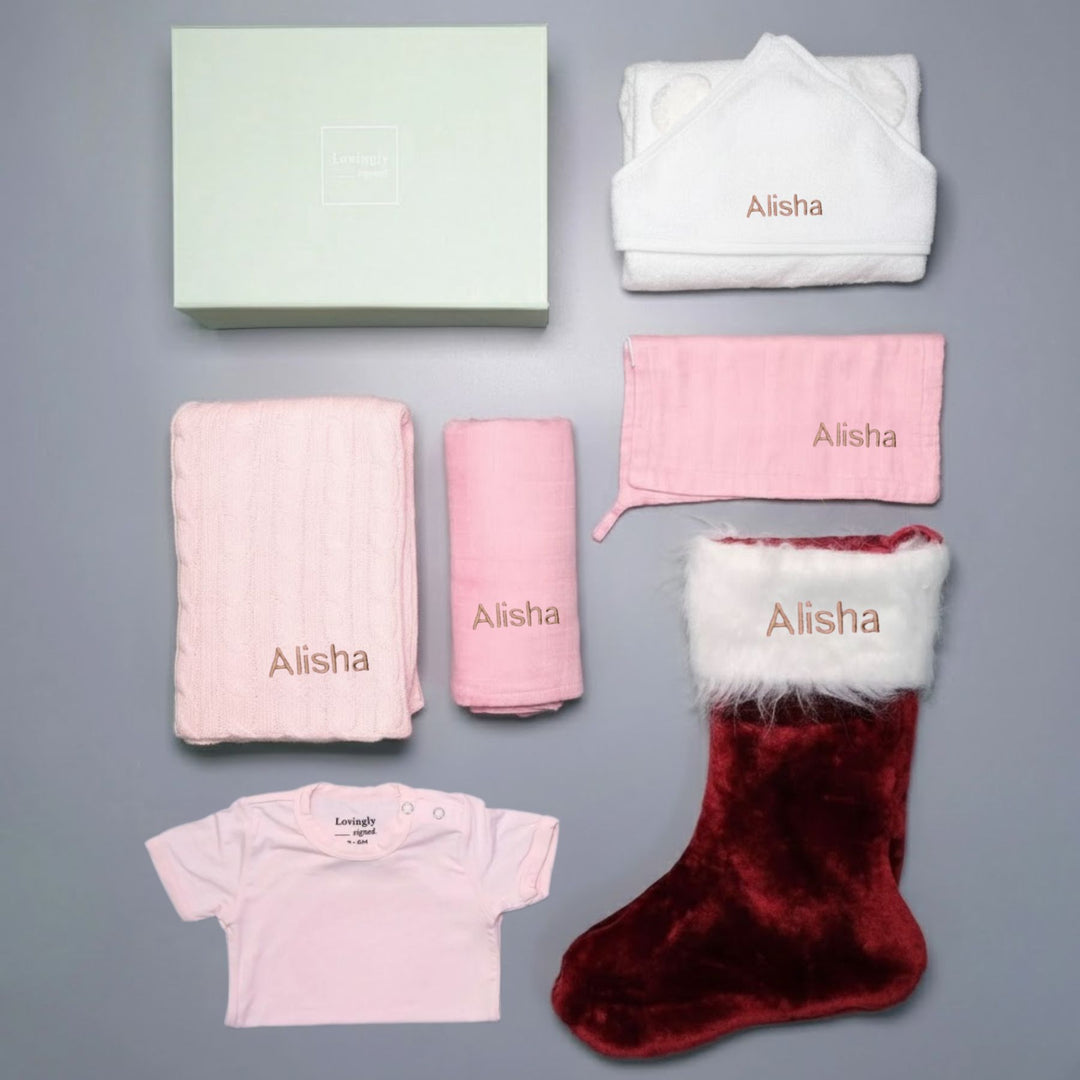 Christmas Themed Gift Set all in Pink with 6 products - Swaddle, Wash Cloth, Hooded Towel, Christmas Edition Babygrow, Bathrobe, Cable Knit Blanket and Red Stocking