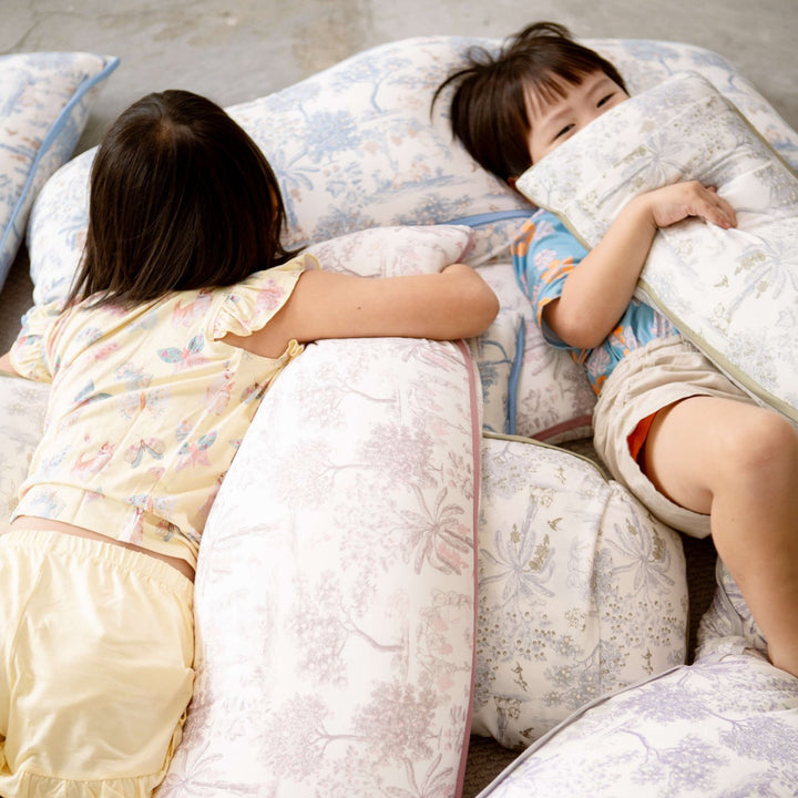 Children hugging House of Holly Luxe Cloud Pillows