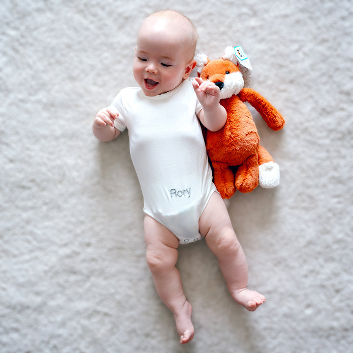 Baby cuddling with Jellycat Bashful Fox Cub