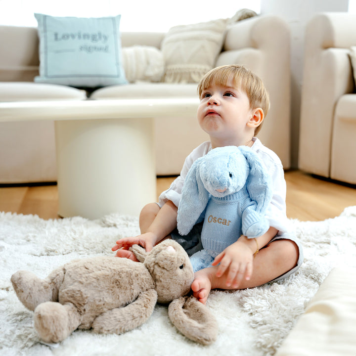 Child Holding Blue Jellycat Bunny