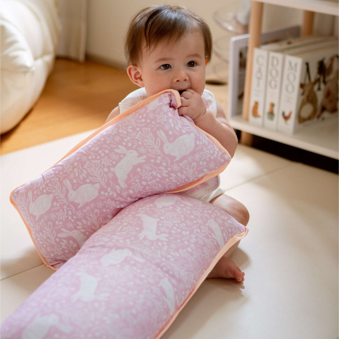 baby playing with Luxe Cloud Pillow - Rabbits Rendezvous