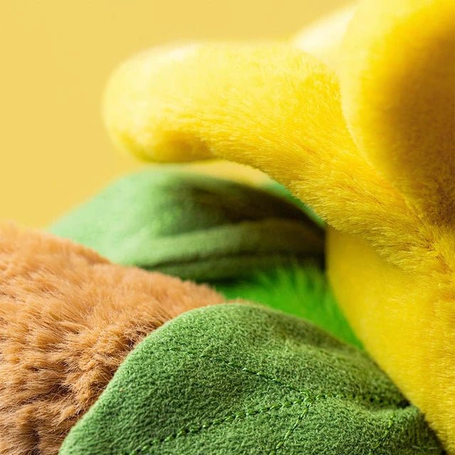 Soft Jellycat Daffodil Bartholomew Bear cuddly toy with fluffy brown fur and yellow petals