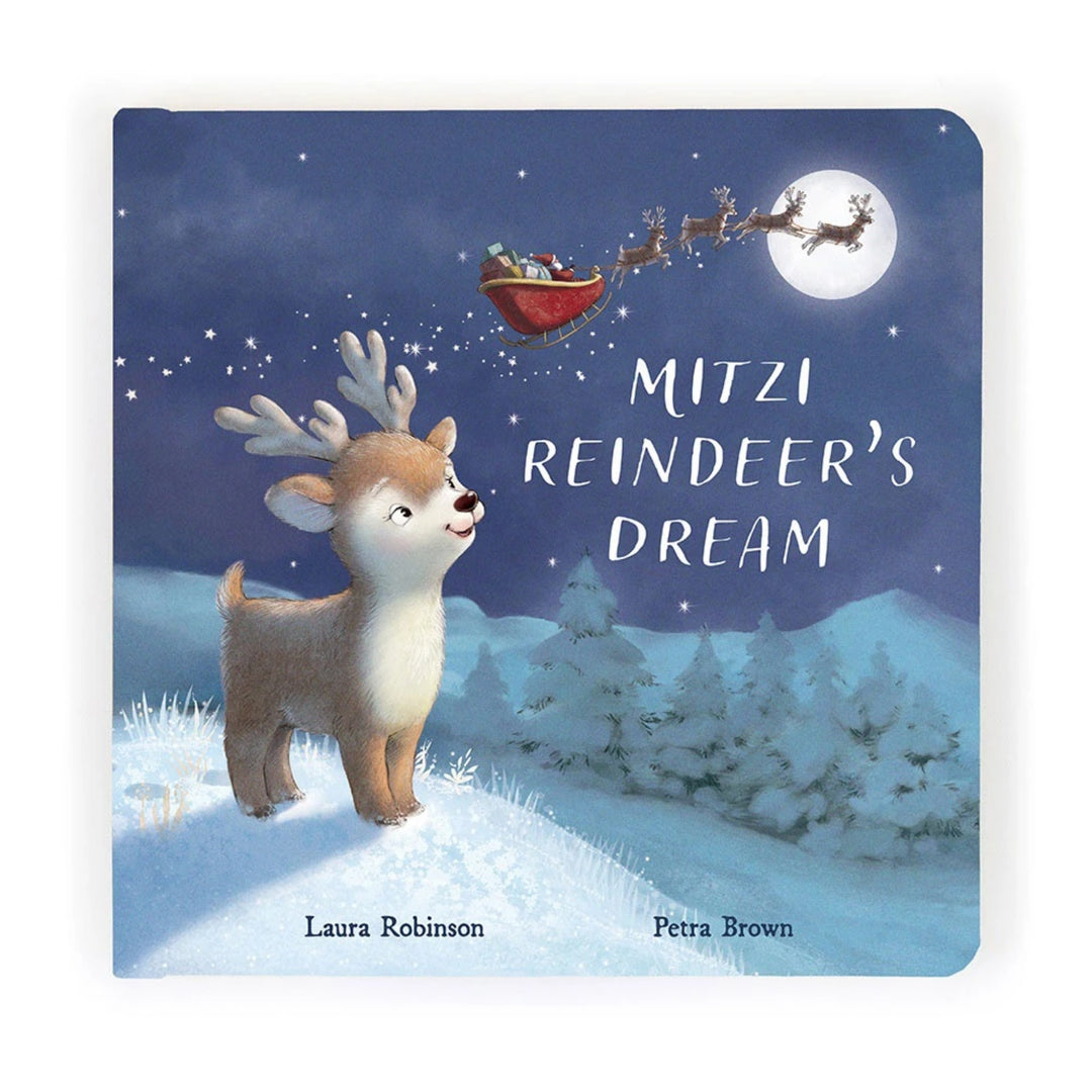 Jellycat “Mitzi Reindeer’s Dream” children’s Christmas board book with a snowy night-time cover featuring a young reindeer watching Santa’s sleigh fly across the moonlit sky.