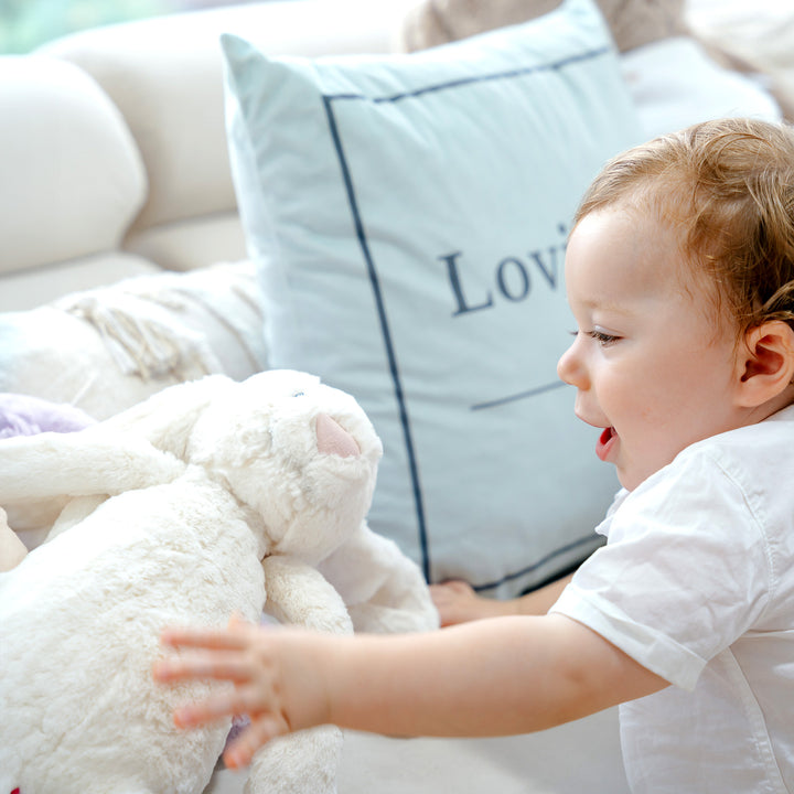 Baby playing with jellycat toy