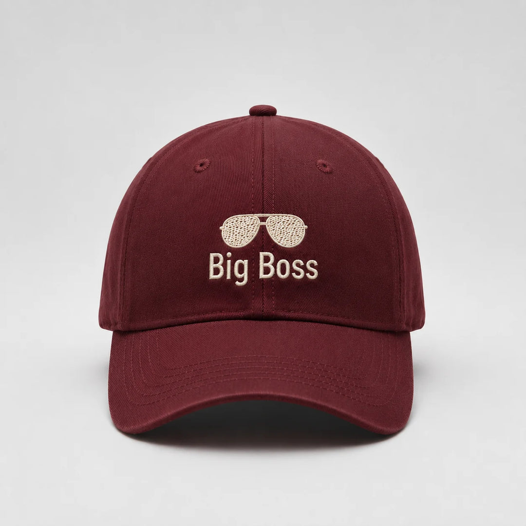 Maroon cap with 'Big Boss' and sunglasses emoji on a light gray background