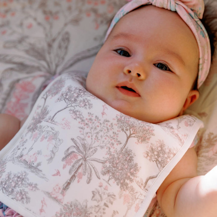 Baby wearing House of Holly Reversible Bamboo Baby Bib with Toile de Jouy Garden Print