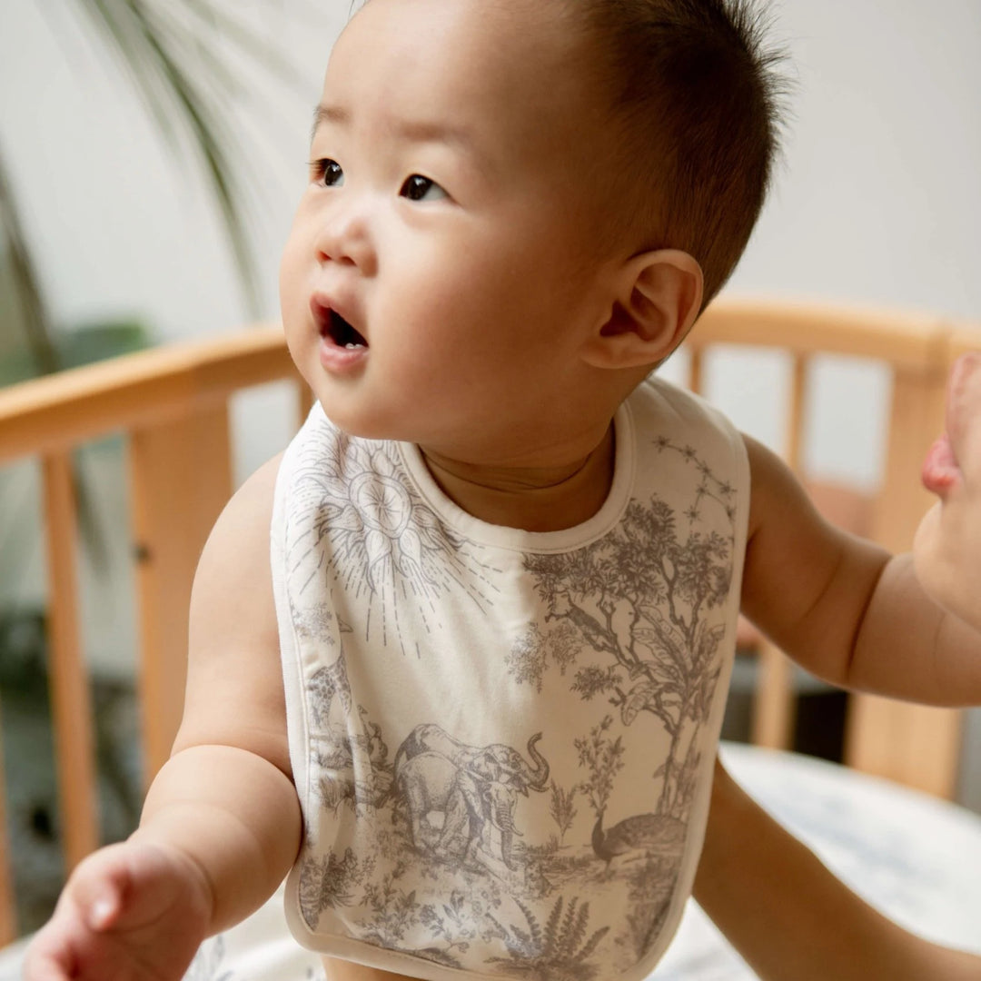 Baby wearing House of holly bib, Breathable and gentle bamboo bib for sensitive baby skin