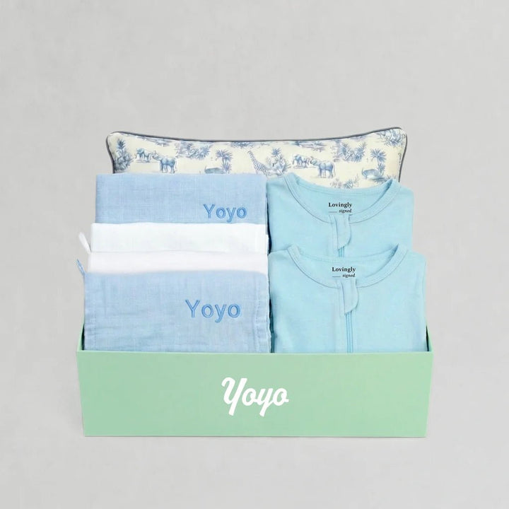 House of Holly x Lovingly Signed collection of baby product,s including swaddles, wash cloths, pillow and sleep bag.