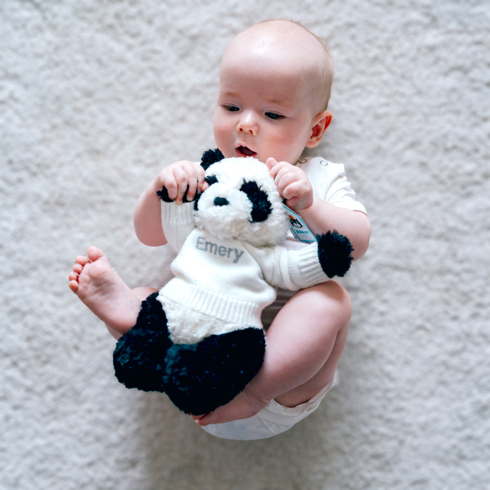 baby playing Personalised Montgomery Panda toy