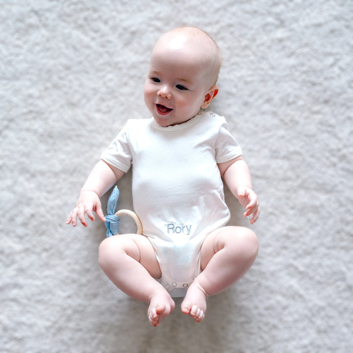 baby playing with Chick Silicone Teether 