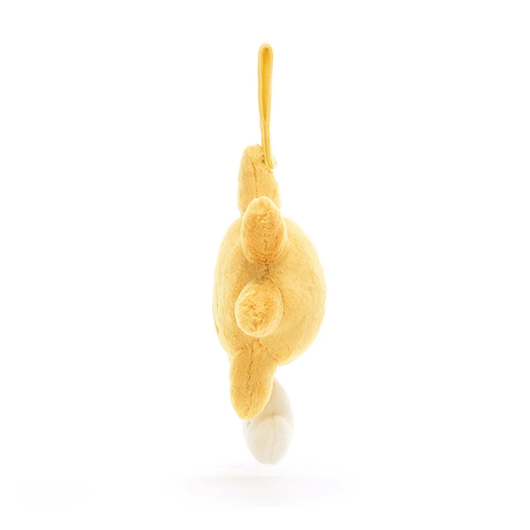 Side view of the Jellycat Amuseables Sun Musical Pull showing its soft yellow plush sun shape, hanging strap and cream cloud pull.
