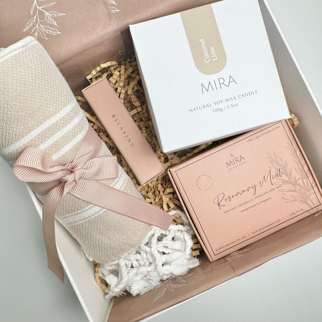 Mira wellness gift set consisting of scarf, body soap bar, candle and essential oil