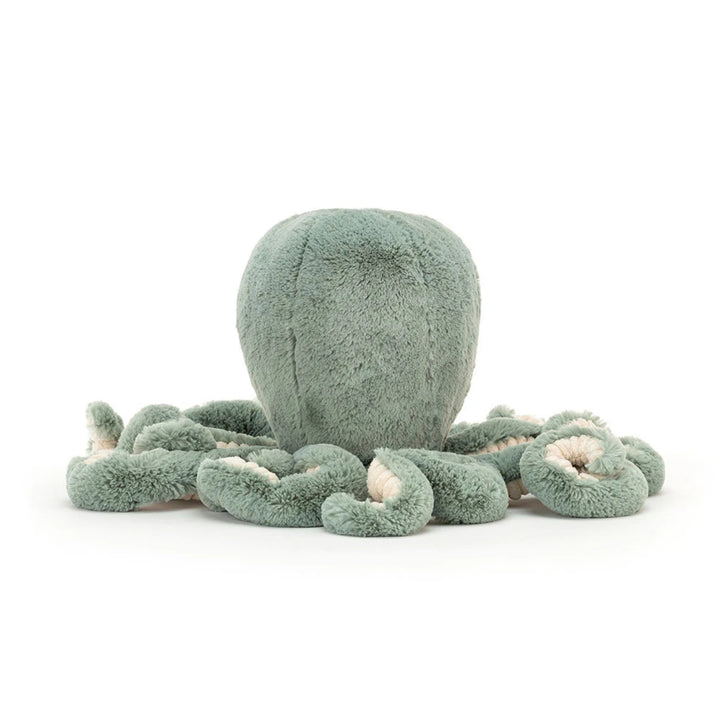 Sage green octopus soft toy shown from the back, featuring a rounded plush head and multiple curled tentacles with contrasting cream corduroy undersides.