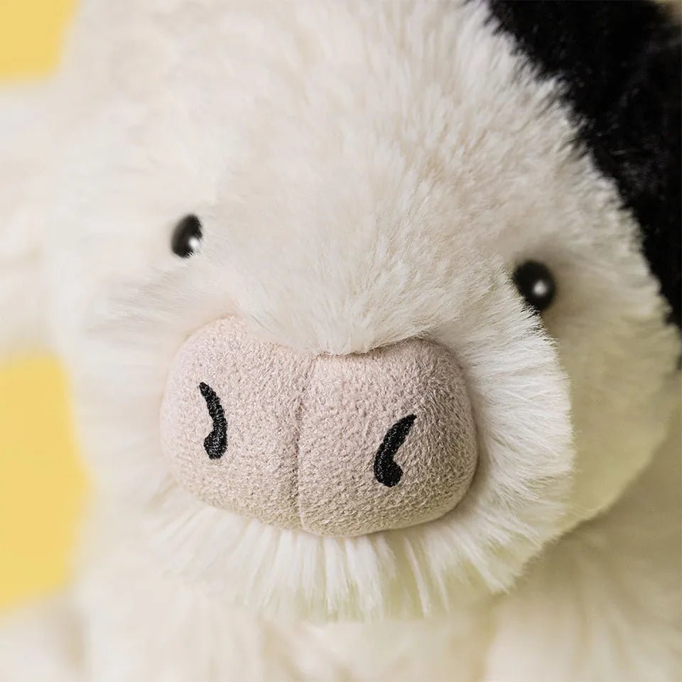 Close-up texture of Jellycat Smudge Cow soft plush fur