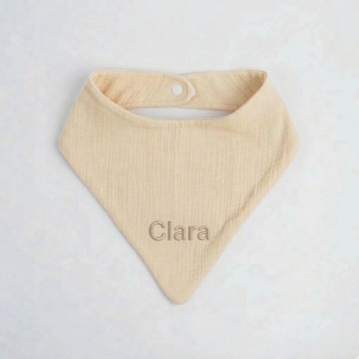 Light Beige baby bib with 'Clara' embroidered in Beige thread