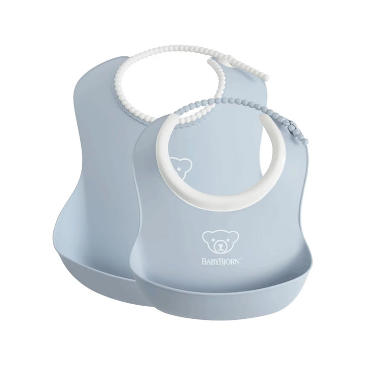 Blue Practical BabyBjörn baby feeding bibs with built-in crumb catcher.