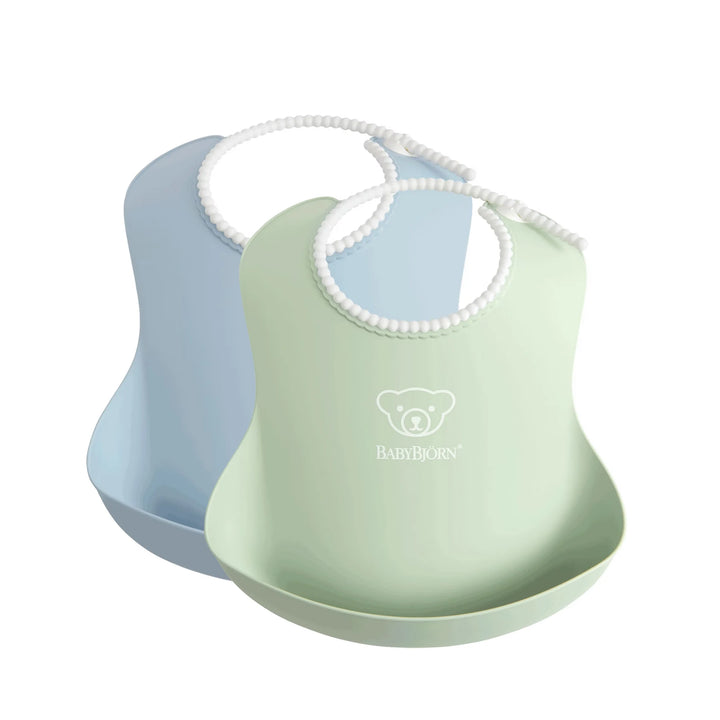 Blue & Green BabyBjörn toddler bibs set with water-resistant, easy-to-wipe material.