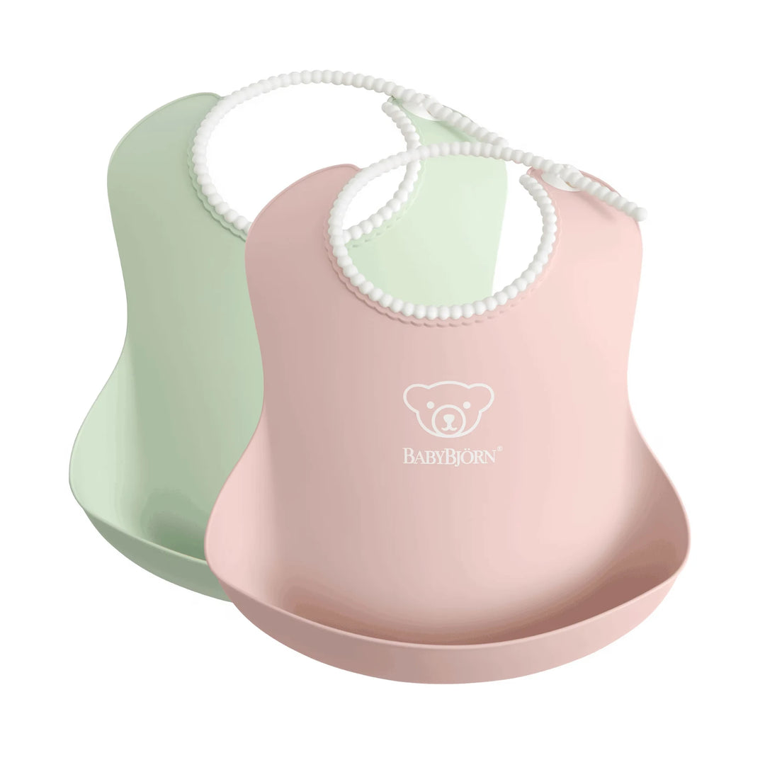 Green & Pink BabyBjörn baby bibs with soft, comfortable neck and deep spill pocket.