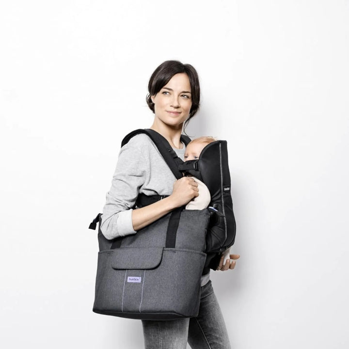 BabyBjörn SoFo diaper bag in gray and lavender with personalised name.