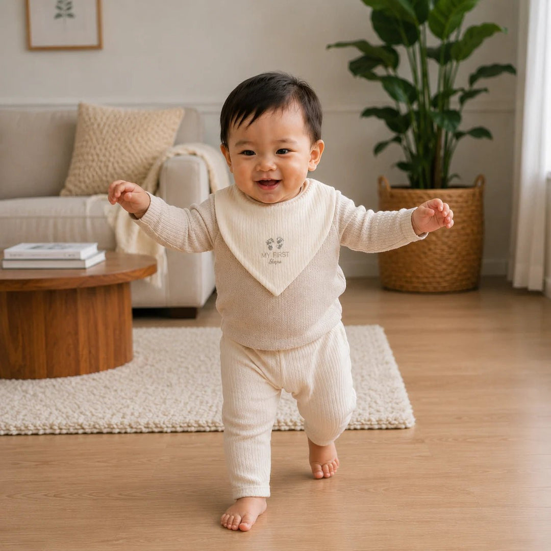 Baby's first walking milestone captured wearing a My First Steps bib