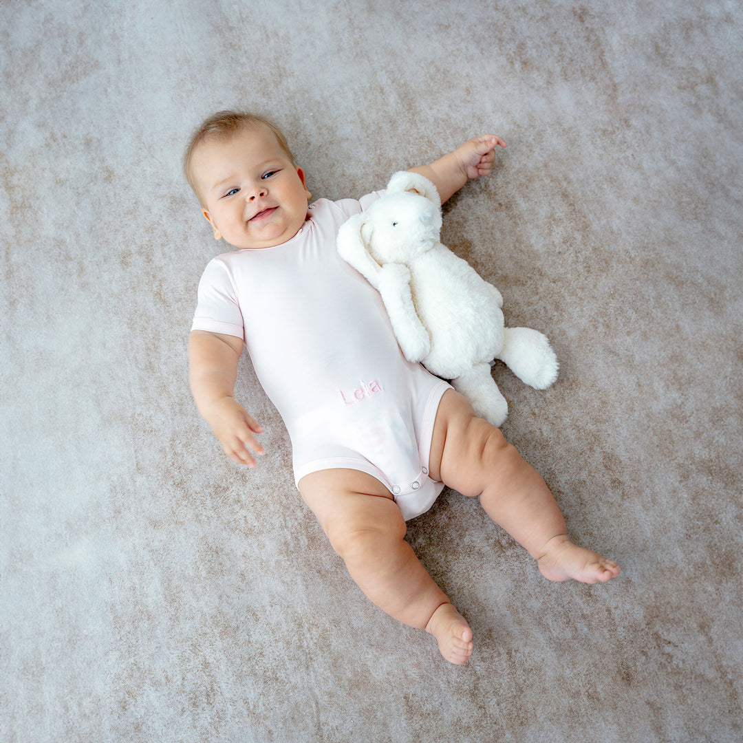 Baby in Pink Bamboo Onesie with Twinkle Bunny