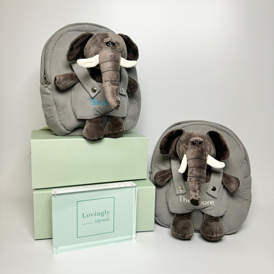 Elephant backpacks with "Giovanni" customised in blue thread and "Theodore" customised in cream thread