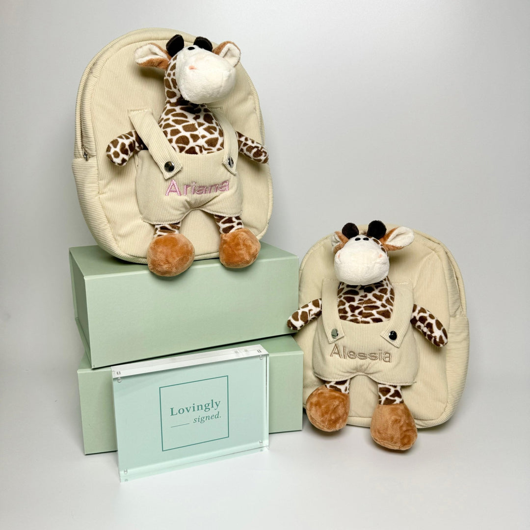 Giraffe backpacks with "Ariana" customised in pink thread and "Alessia" customised in beige thread