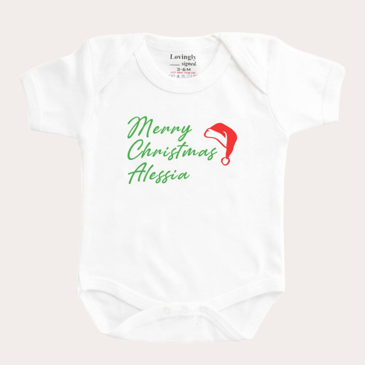 Merry Christmas Edition babygrow with red santa hat and personalised with "Alessia"