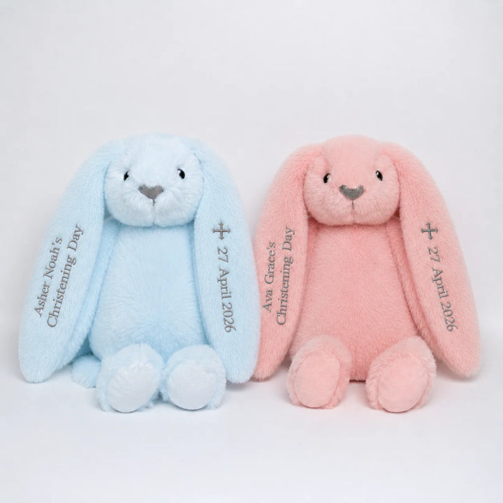 Two plush bunny toys, one blue and one pink, with personalised name for christening day 