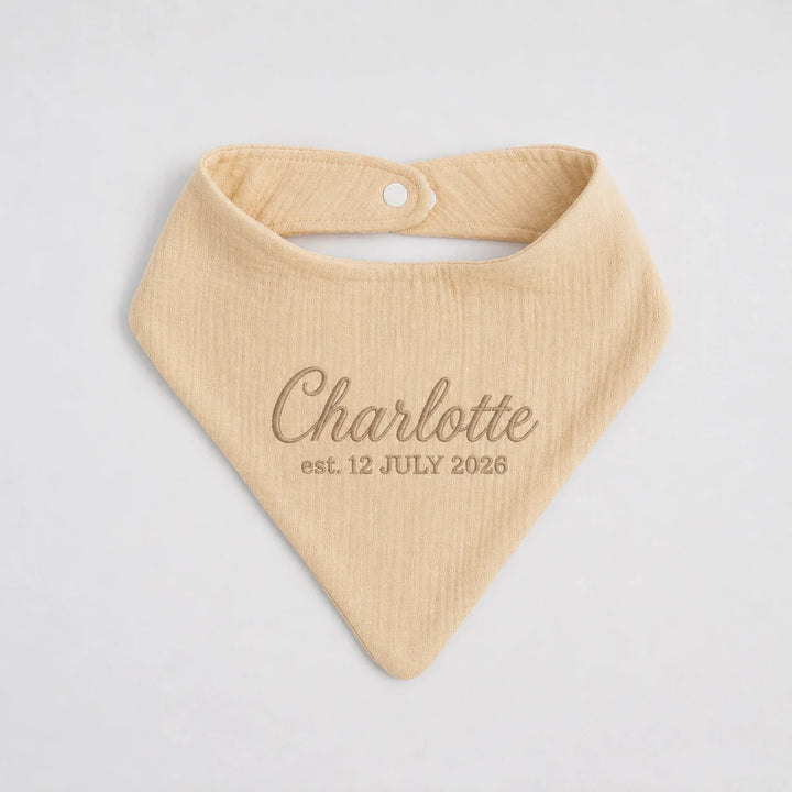 Personalised beige baby bib with embroidered name Charlotte and birth date