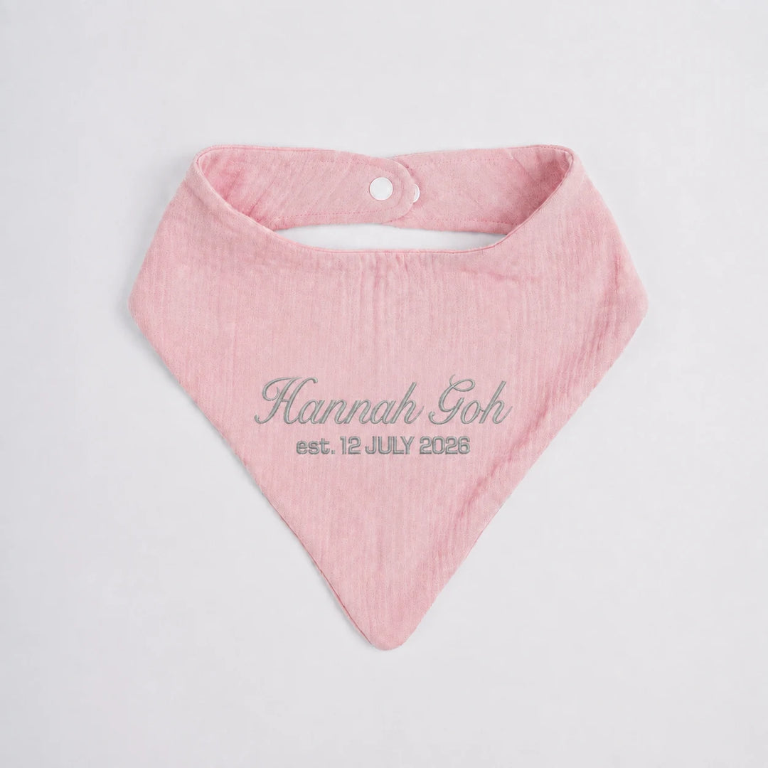 Personalised pink baby bib with embroidered name Hannah Goh and birth date