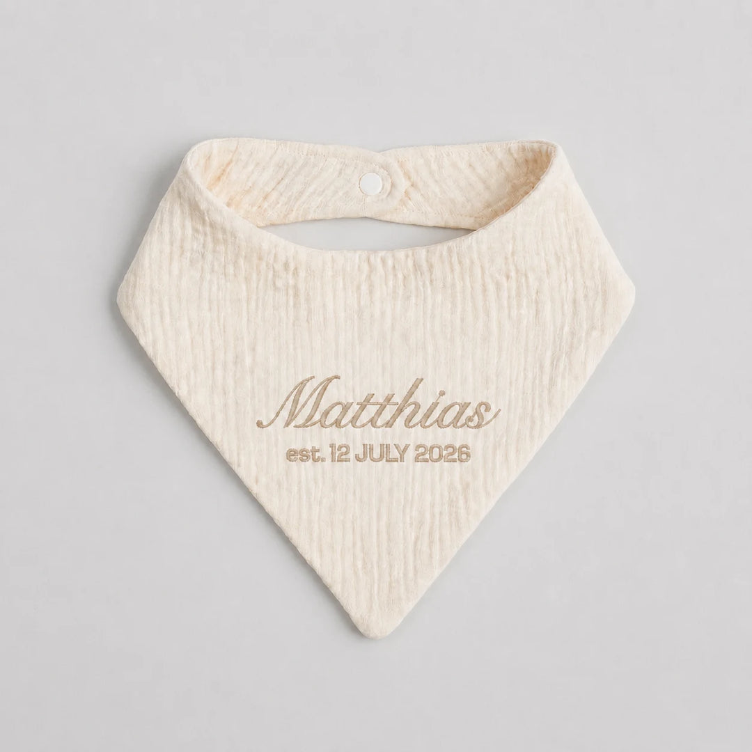 Personalised cream baby bib with embroidered name Matthias and birth date