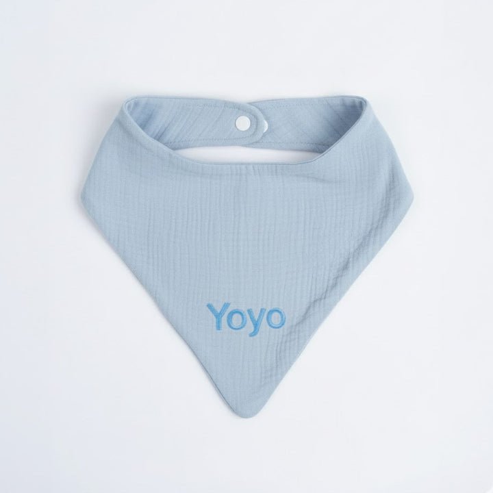 Light blue baby bib with 'Yoyo' branding on a white background