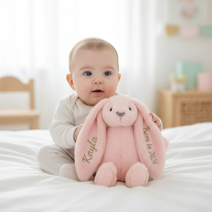 Baby playing with Custom newborn gift Twinkle Bunny with baby name and “Born in 2026” stitched on ears