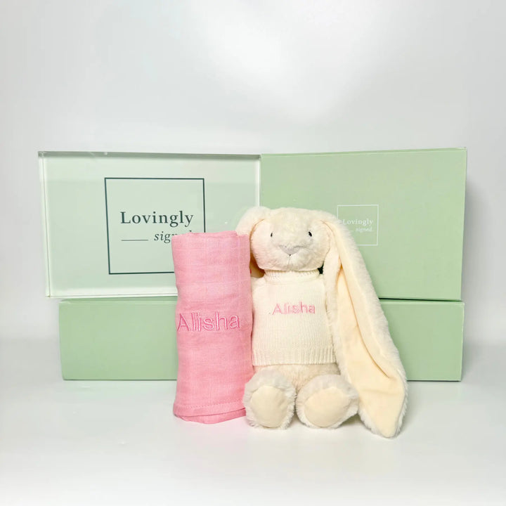 Pink swaddle blanket and cream bunny toy with 'Alisha' embroidery 