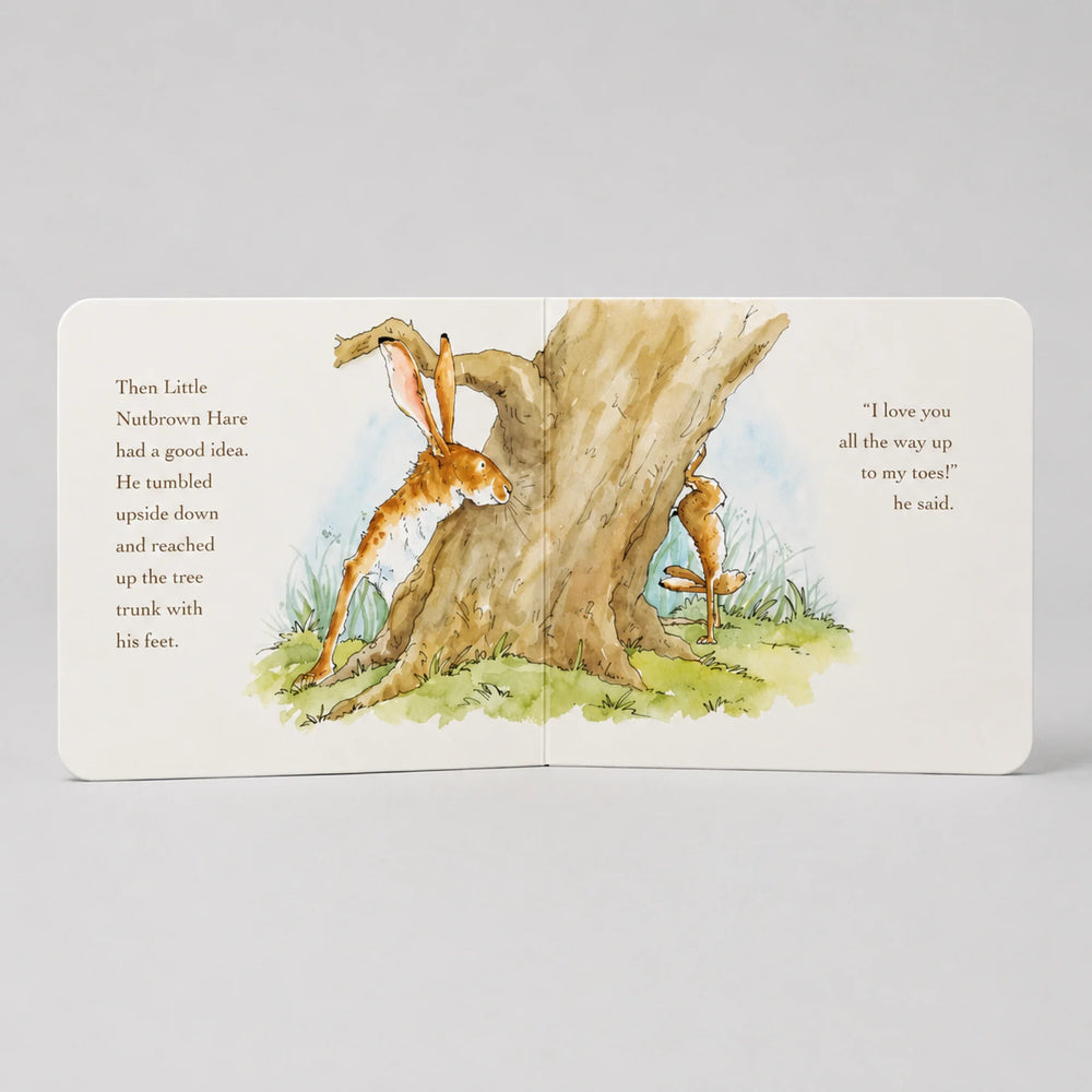 Illustrated book page with a rabbit and carrot near a tree, on a light gray background