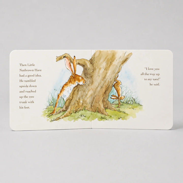 Illustrated book page with a rabbit and carrot near a tree, on a light gray background