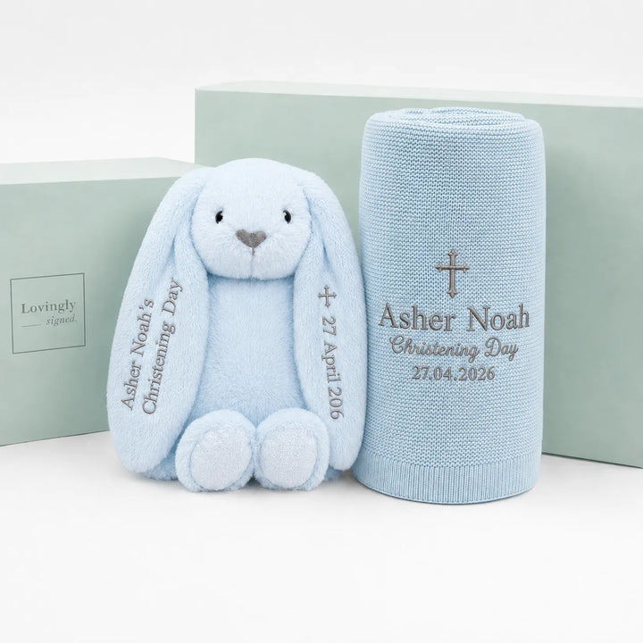 Personalised blue christening gift set with a blue bunny soft toy and matching embroidered blue blanket, displayed with Lovingly Signed gift boxes.