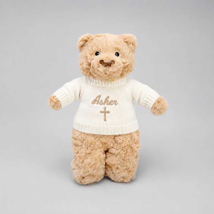 Personalised Christian teddy bear with embroidered name Asher and cross on cream jumper
