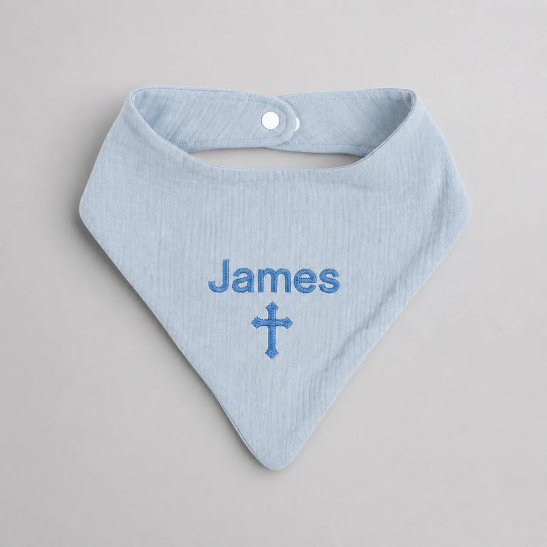 Personalised blue Christian baby bib with embroidered name James and cross