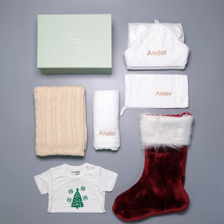 Christmas Themed Gift Set all in white with 6 products - Swaddle, Wash Cloth, Hooded Towel, Christmas Edition Babygrow, Bathrobe, Cable Knit Blanket and Red Stocking