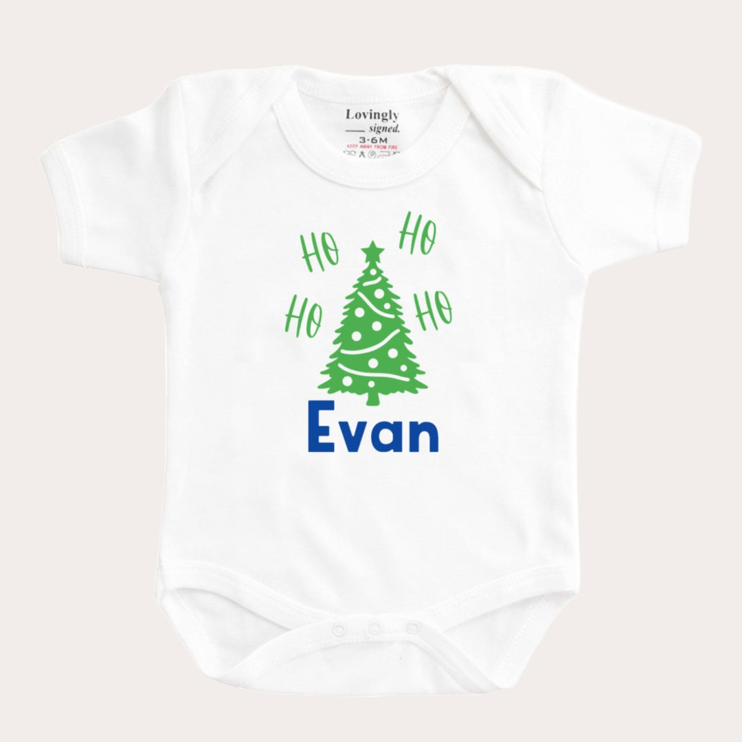 Christmas tree and "ho ho ho" design on white bamboo babygrow with "Evan" personalised in Blue