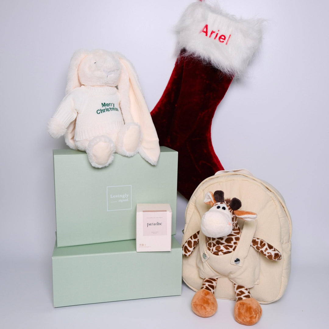 Christmas Themed Gift Hamper consisting of 4 products - Twinkle Bunny, red stocking, giraffe backpack and soy candle