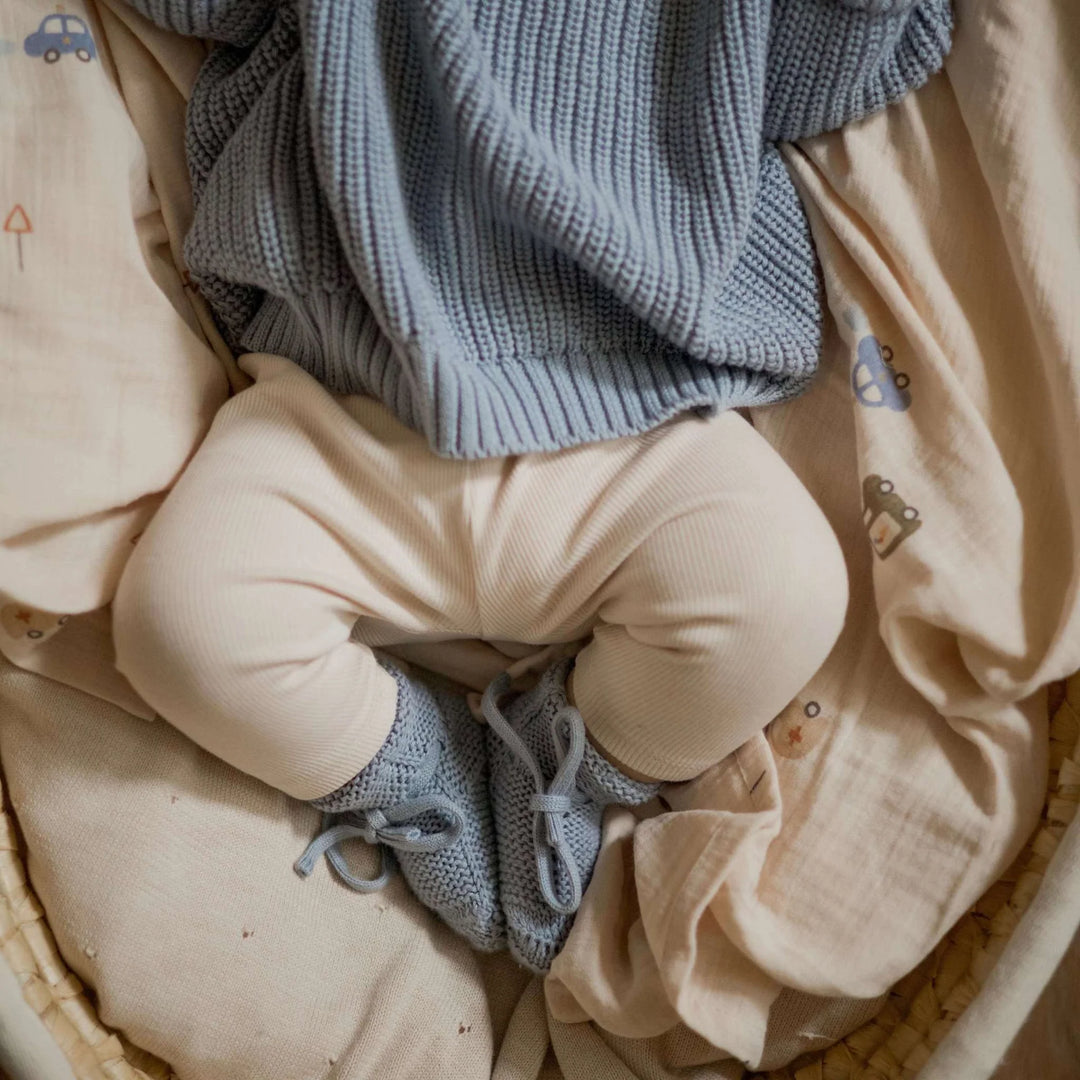 Baby wearing Cosy Roots Organic Knit Booties - Dusty Blue