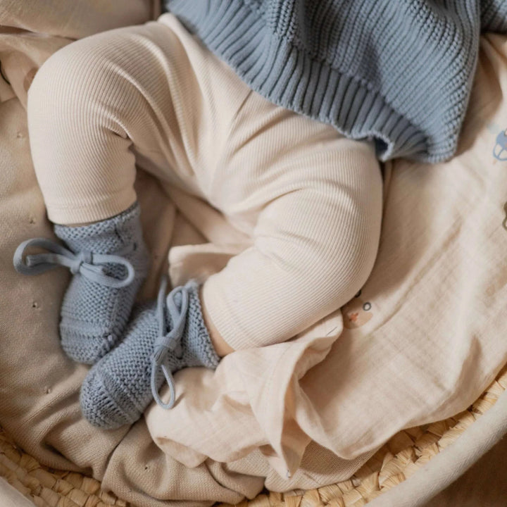 Baby wearing Cosy Roots Organic Knit Booties - Dusty Blue