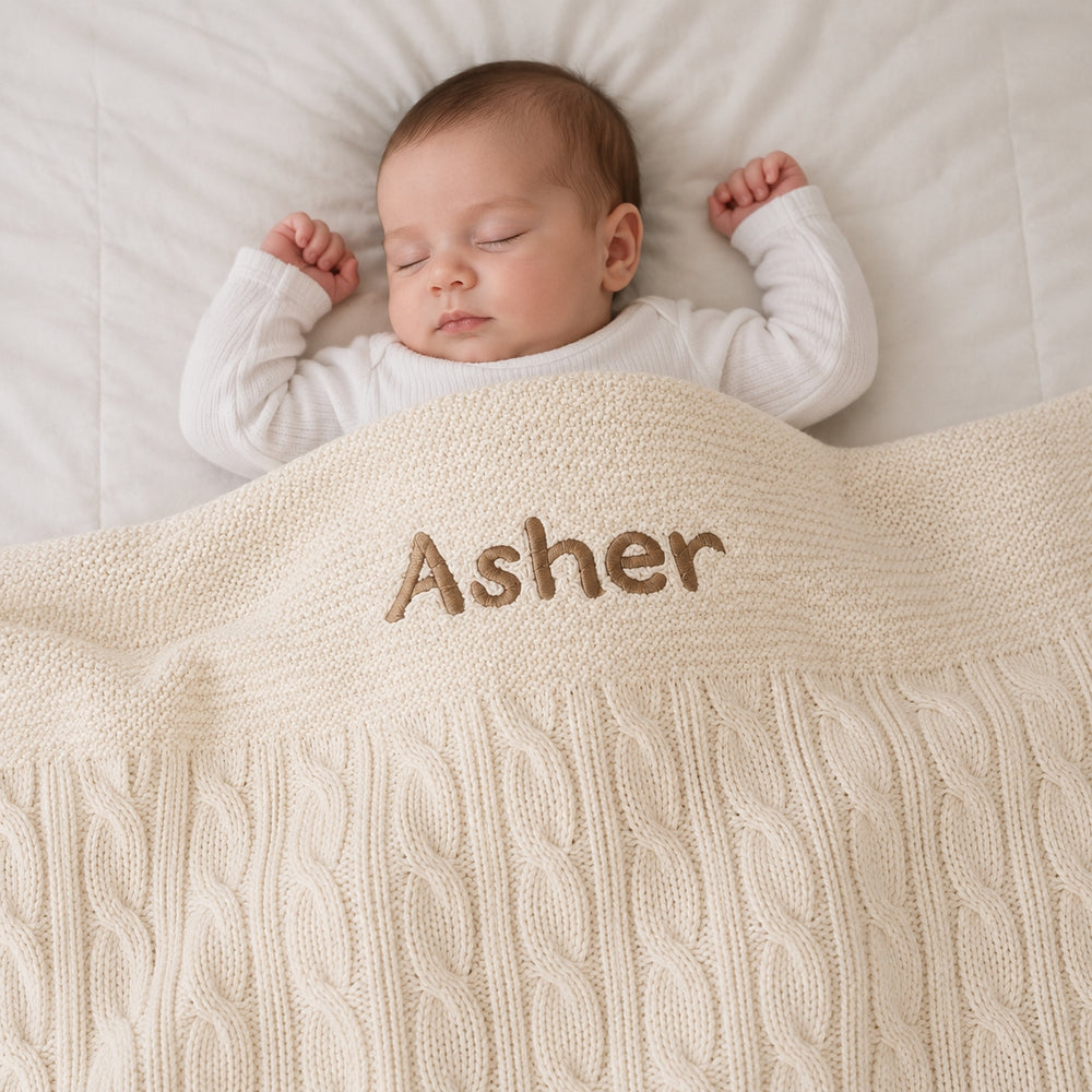 Smiley Baby covering with Cream Cable Knit Blanket