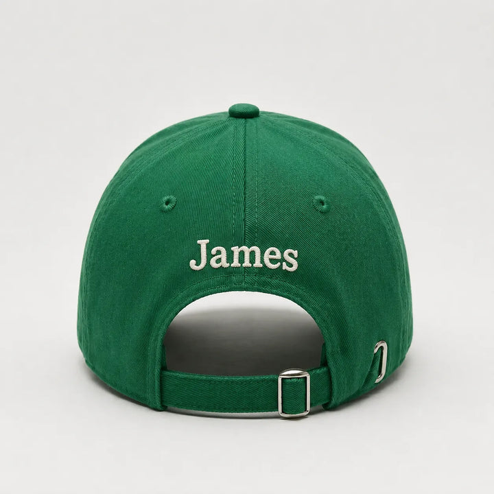Green cap with 'James' embroidered on the back against a light gray background